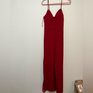 Red jumpsuit with peekaboo lace on legs